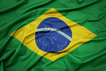 Fototapete Brasilien Wehende Nationalflagge Brasiliens in Farben  © luzitanija