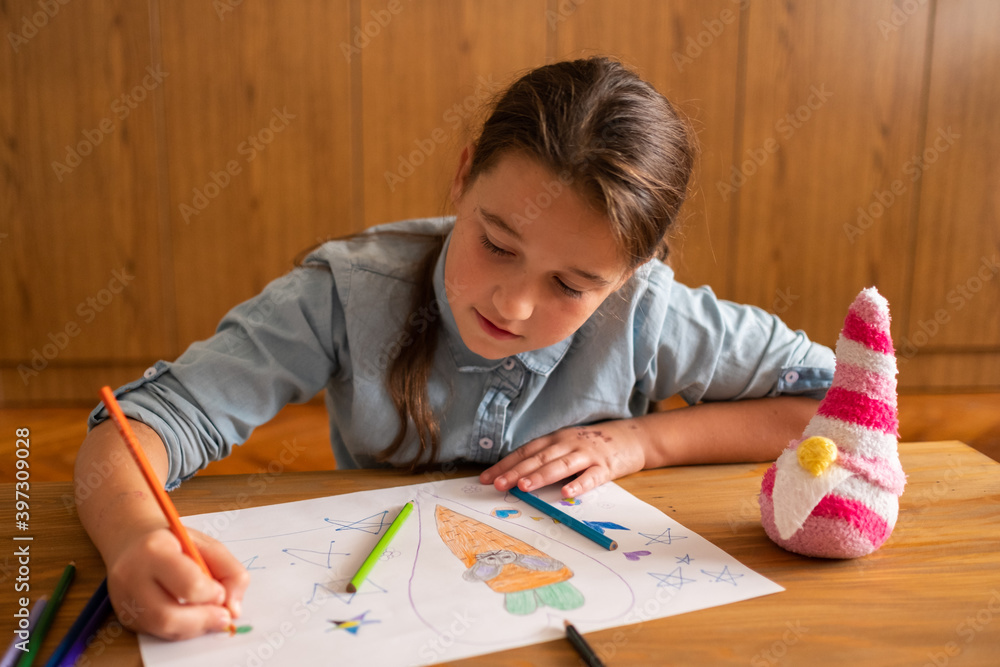 Cute little girl drawing at flat Cute little girl drawing at flat