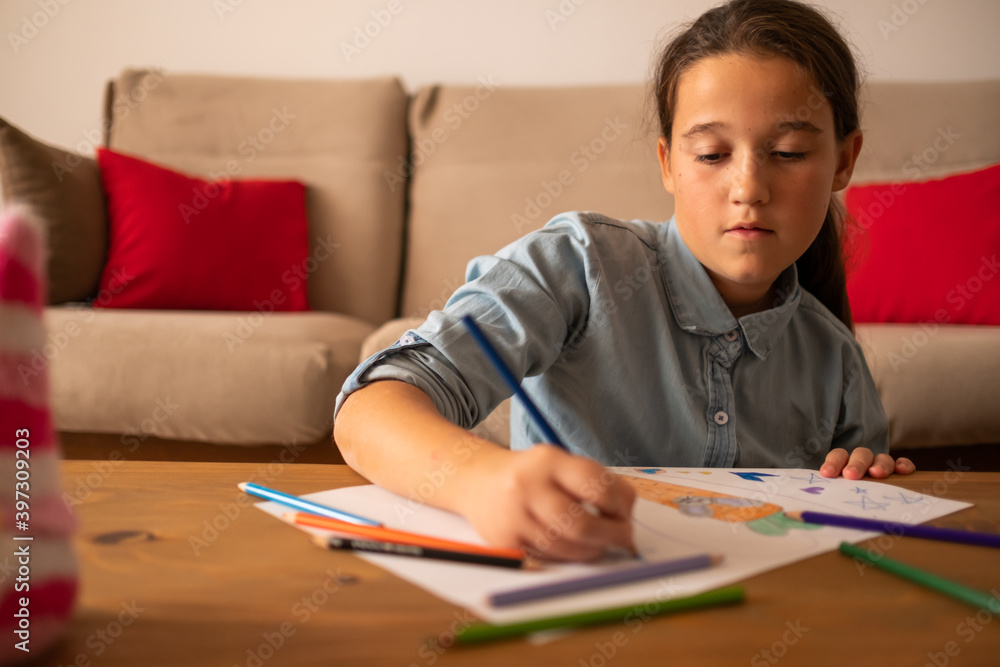 Cute little girl drawing at living room Cute little girl drawing at living room