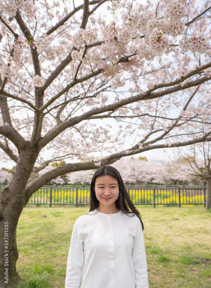 A Portrait of a Woman with Beautifully Flowing Cherry Blossom A Portrait of a Woman with Beautifully Flowing Cherry Blossom