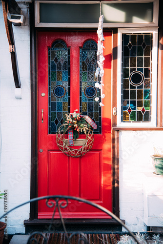 Colorful door with stained glass and wreath