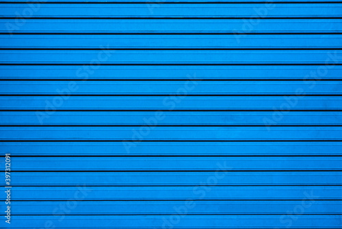 Blue wall with straight stripes
