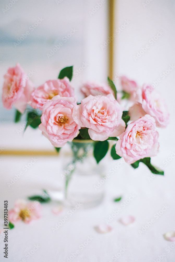 pink roses in a glass vase pink roses in a glass vase