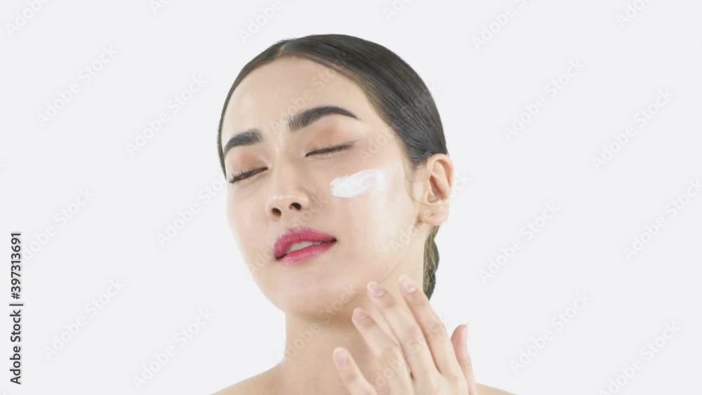 Beauty concept of 4k Resolution. Young Asian woman applying cream on her face. Beauty concept of 4k Resolution. Young Asian woman applying cream on her face.