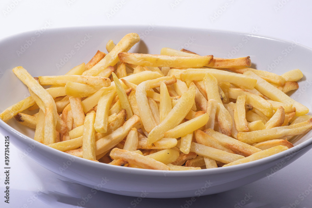 French fries make in oven on a white plate
French fries make in oven on a white plate