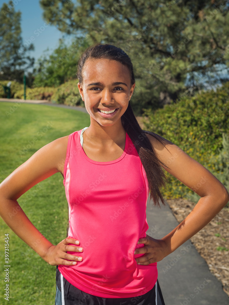 Mixed race girl smiling in park Mixed race girl smiling in park