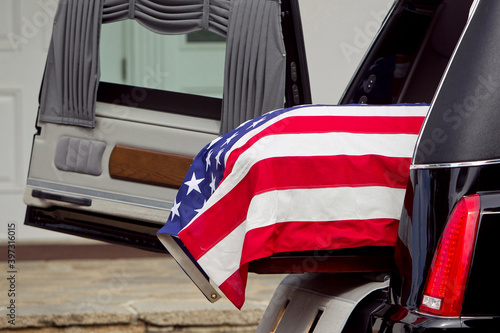 American flag over casket at military funeral photo