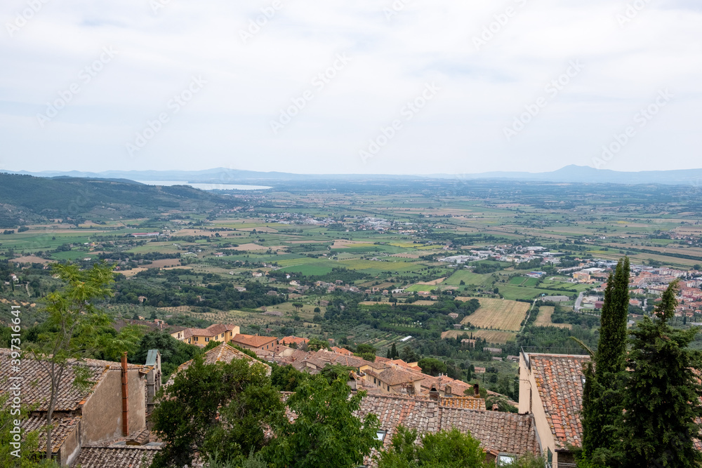 scenic Tuscan landscape from terrace in sunny summer day