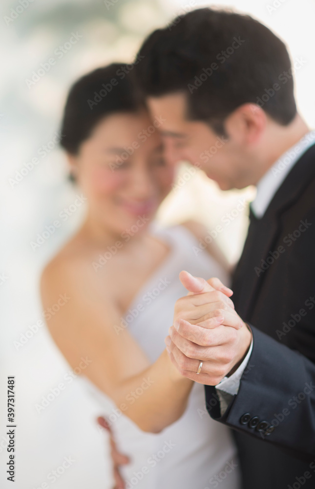 Newlywed couple dancing at wedding reception Newlywed couple dancing at wedding reception