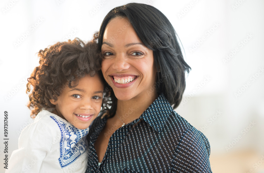 Portrait of smiling African American mother and daughter Portrait of smiling African American mother and daughter