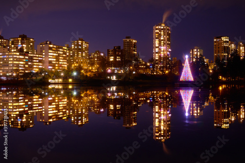 Christmas Tree in Lost Lagoon Vancouver. A Christmas tree illuminates the center of Lost Lagoon in Stanley Park  British Columbia.  