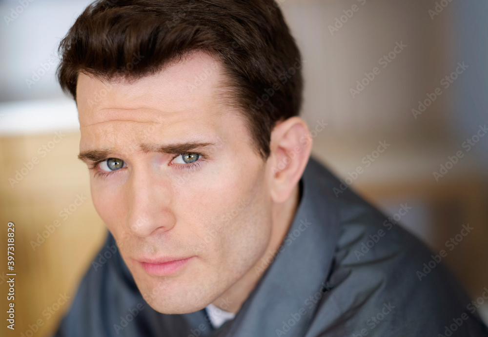 Close up of Caucasian man frowning Close up of Caucasian man frowning