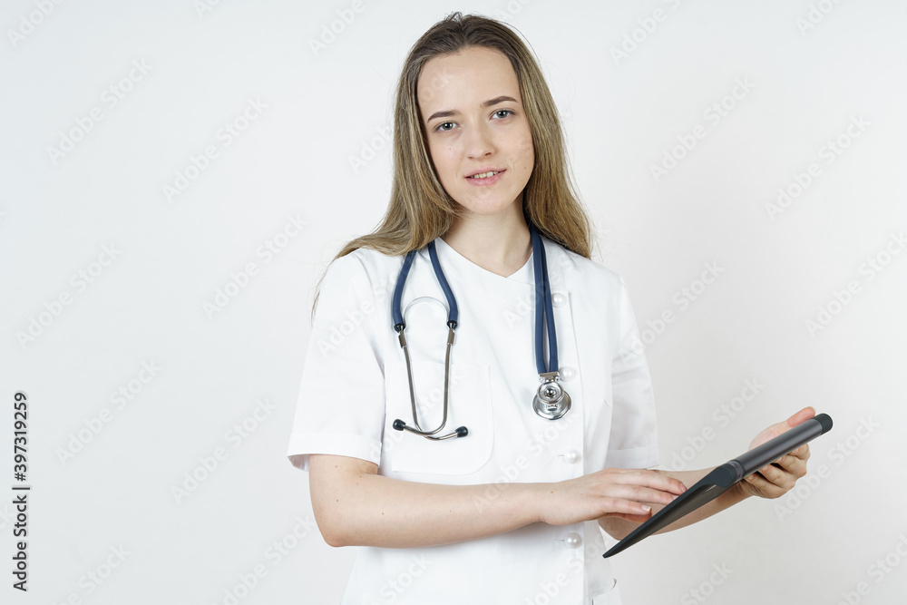 Medicine and health concept. The doctor writes the information into the tablet. Medicine and health concept. The doctor writes the information into the tablet.