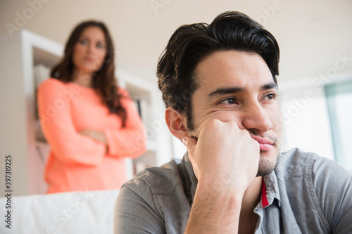 Couple arguing in living room photo