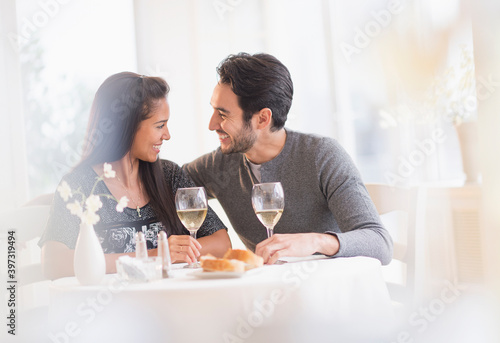 Couple having dinner together in restaurant photo