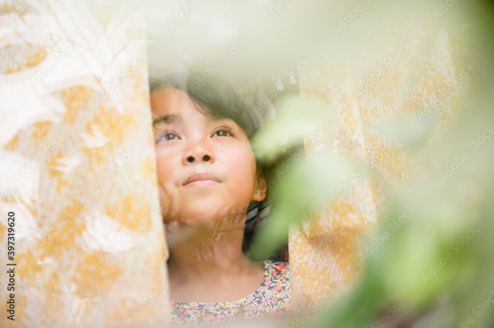 Filipino girl looking out window Filipino girl looking out window