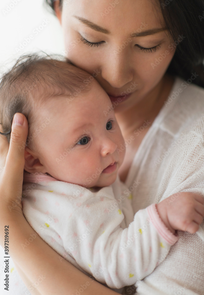 Asian mother holding baby Asian mother holding baby