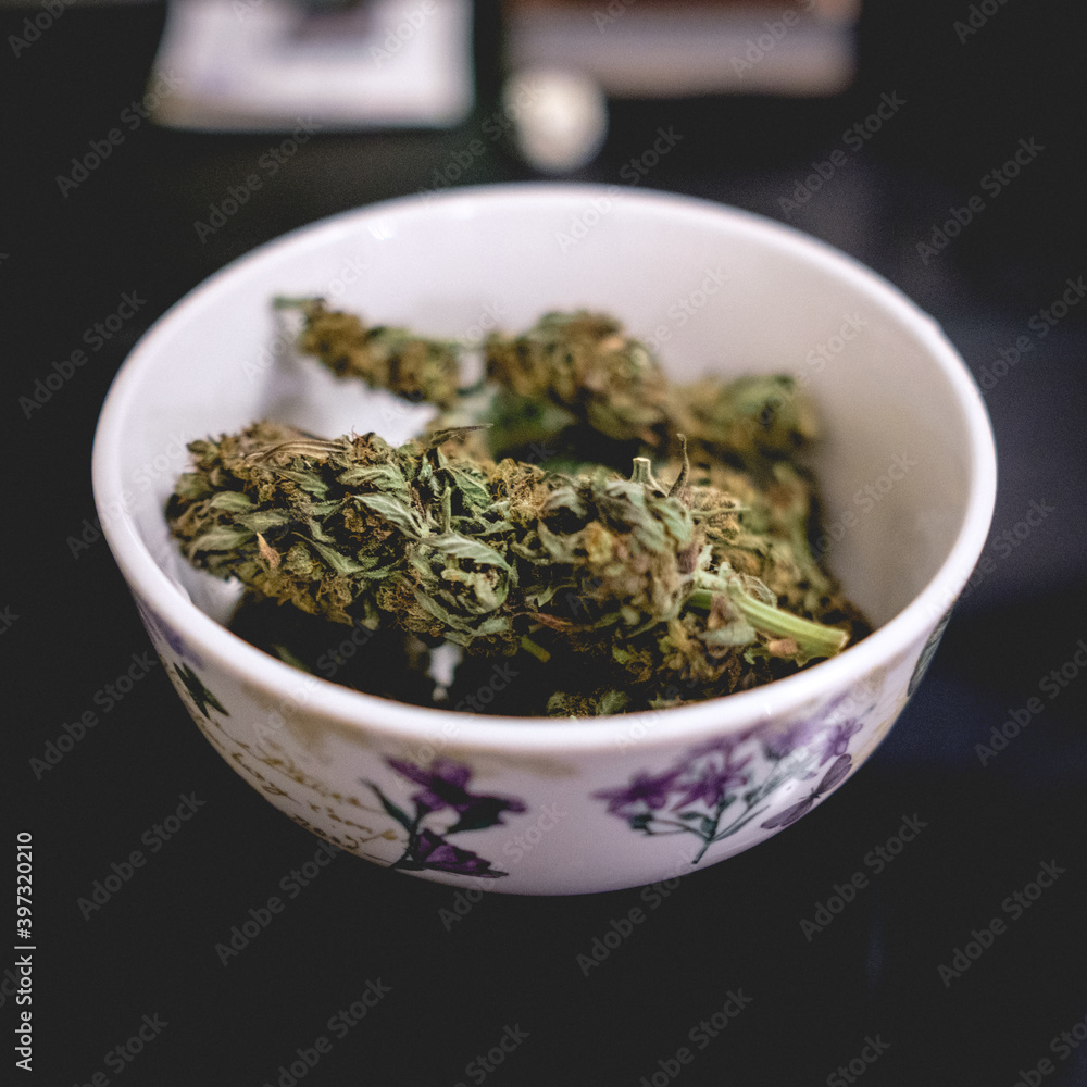 Awesome marijuana buds in a white bowl Awesome marijuana buds in a white bowl