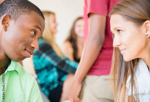 Teenagers face to face at party