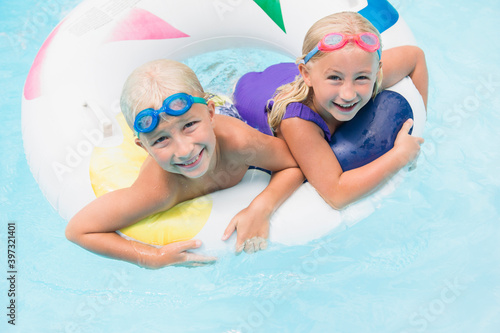 Wallpaper Mural Caucasian children playing in swimming pool Torontodigital.ca