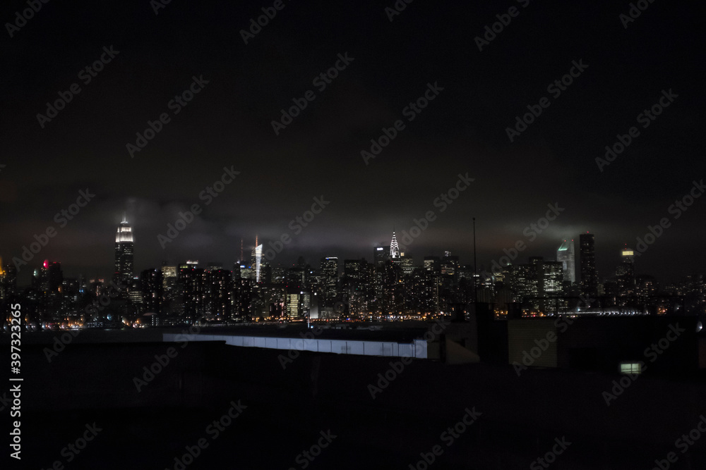 Illuminated New York City skyline at night, New York, United States Illuminated New York City skyline at night, New York, United States