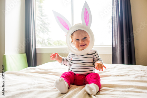 Caucasian baby girl wearing Easter Bunny costume photo