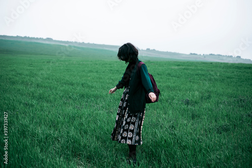 Caucasian woman standing in field of grass photo