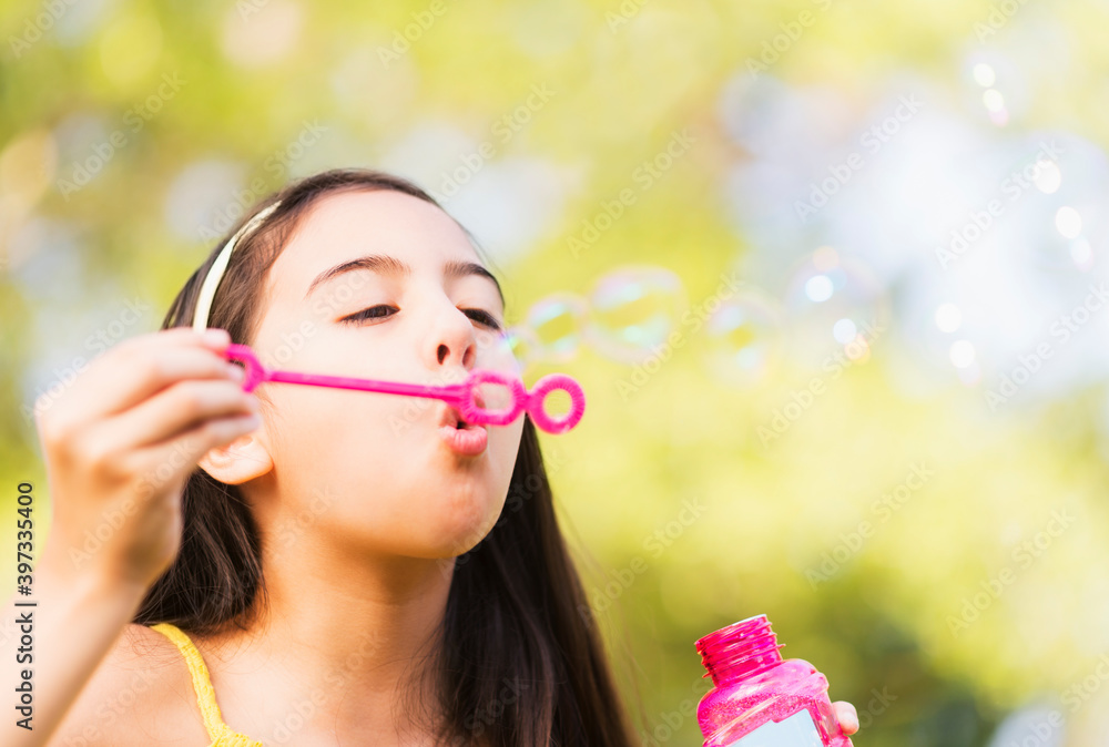 Portrait of girl (8-9) blowing bubbles Portrait of girl (8-9) blowing bubbles