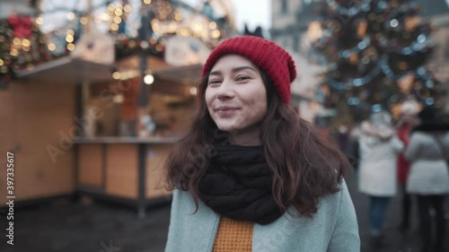 Wallpaper Mural Portrait of beautiful young woman in a center of christmas fair. Girl smiling in front of christmas tree, enjoying holiday season atmosphere, surrounded by decorations. Concept of travel, vacation. Torontodigital.ca
