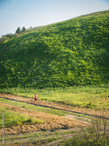 Woman running in field photo