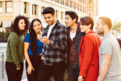 Group of young adults stand and wait for their ride - App - Ride Share - Urban