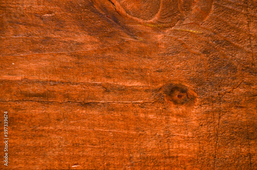 Textura en madera rojiza con vetas y nudos natural de piso o techo photo