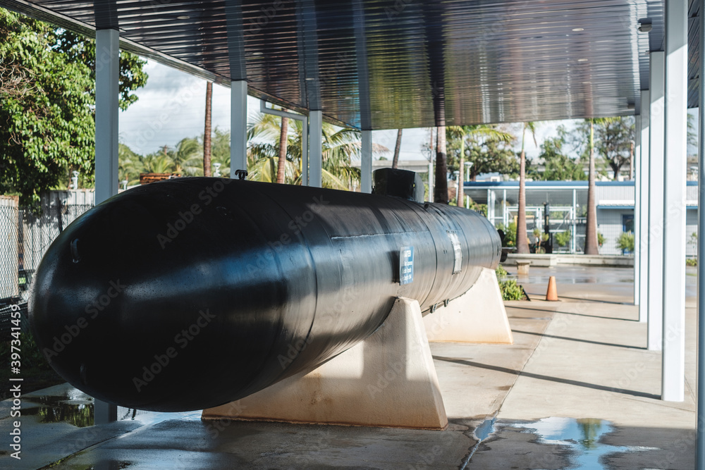 a large cannon in a glass enclosure a large cannon in a glass enclosure