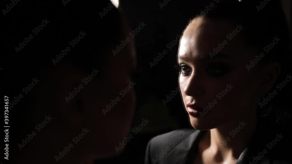 Beautiful fashion model posing in dark Beautiful fashion model posing in dark
