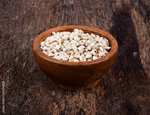 Millet in wood bowl on wooden