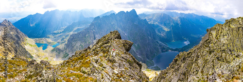 Panorama of High Tatras mountains. View from mt Rysy (2503m) on the border between Slovakia (left) and Poland (right). Zabie lakes (Slovakia) and Morskie Oko lake (Poland) on background