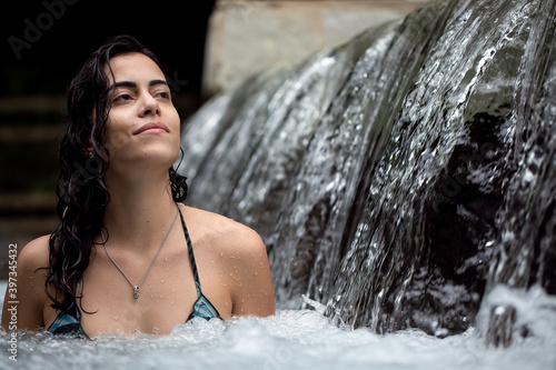 A brunette woman relaxing in the waters of a river. Leisure. healthy life. Resort in the midwest of Brazil. Cerrado. Lifestyle. Life in Nature. Nature journey 