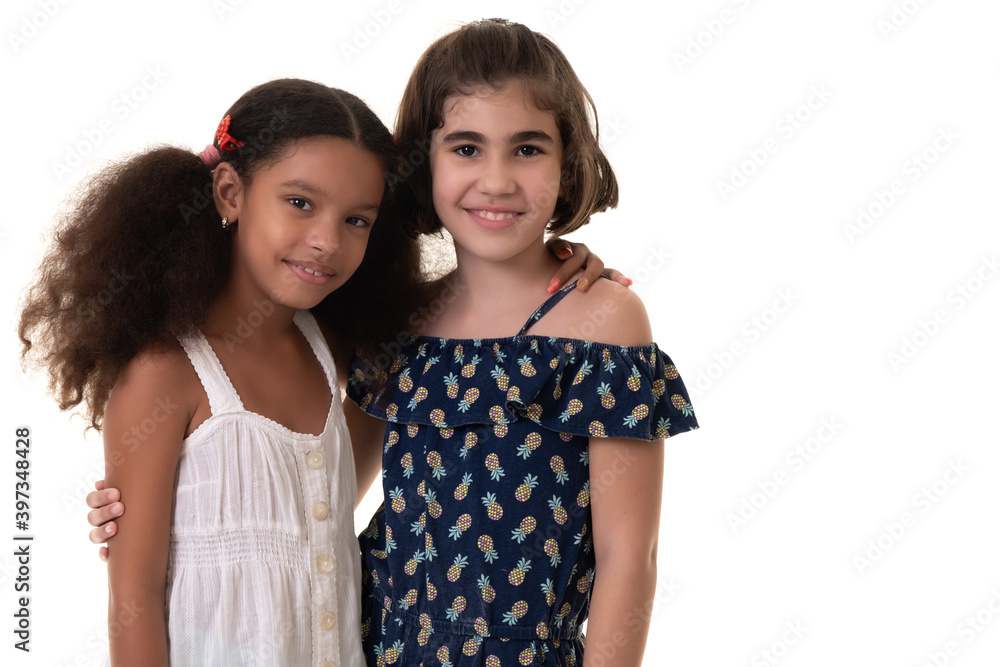 Two friendly small girls hugging isolated on white Two friendly small girls hugging isolated on white