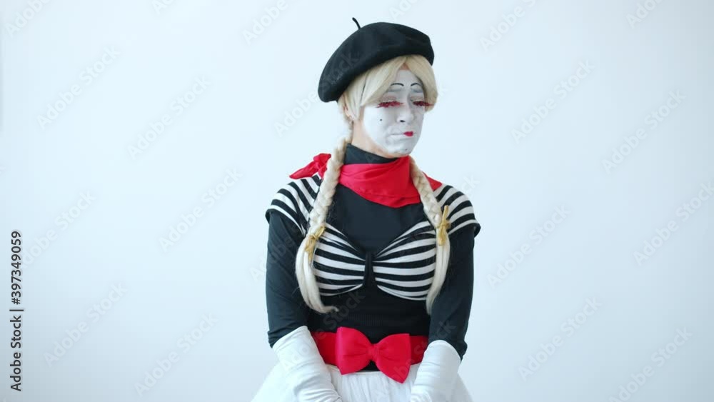 Slow motion of sad and offended woman mime looking at camera and moving lips blinking expressing negative emotions. People and sadness concept. Slow motion of sad and offended woman mime looking at camera and moving lips blinking expressing negative emotions. People and sadness concept.