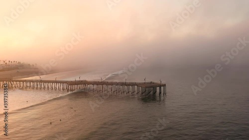 Wallpaper Mural Drone shot of surfers surfing at Pismo Beach Pier Torontodigital.ca