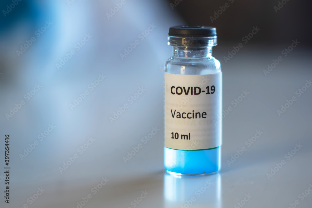 Concept of Covid 19 vaccine vaccinating, development and creation, doctor or scientist in laboratory holding a single dose of 2019-ncov vaccine, a syringe and ampule with SARS-CoV-2 vaccination Concept of Covid 19 vaccine vaccinating, development and creation, doctor or scientist in laboratory holding a single dose of 2019-ncov vaccine, a syringe and ampule with SARS-CoV-2 vaccination