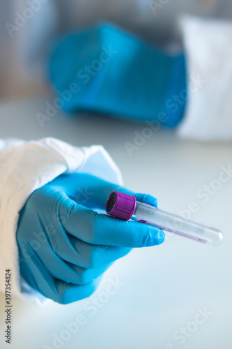Process of coronavirus testing examination by nurse medic in laboratory lab, COVID-19 swab collection kit, test tube for taking OP NP patient specimen sample, patient receiving a corona test