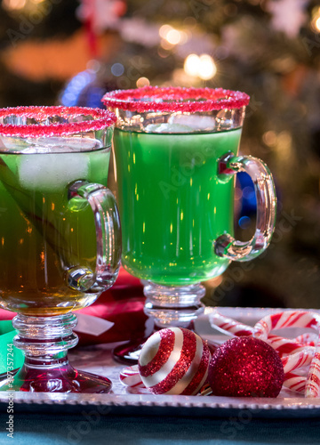 Christmas green  punch drink with a red sugar rim on a holiday glass, a perfect drink for your favorite Grinch at  Christmas time  photo