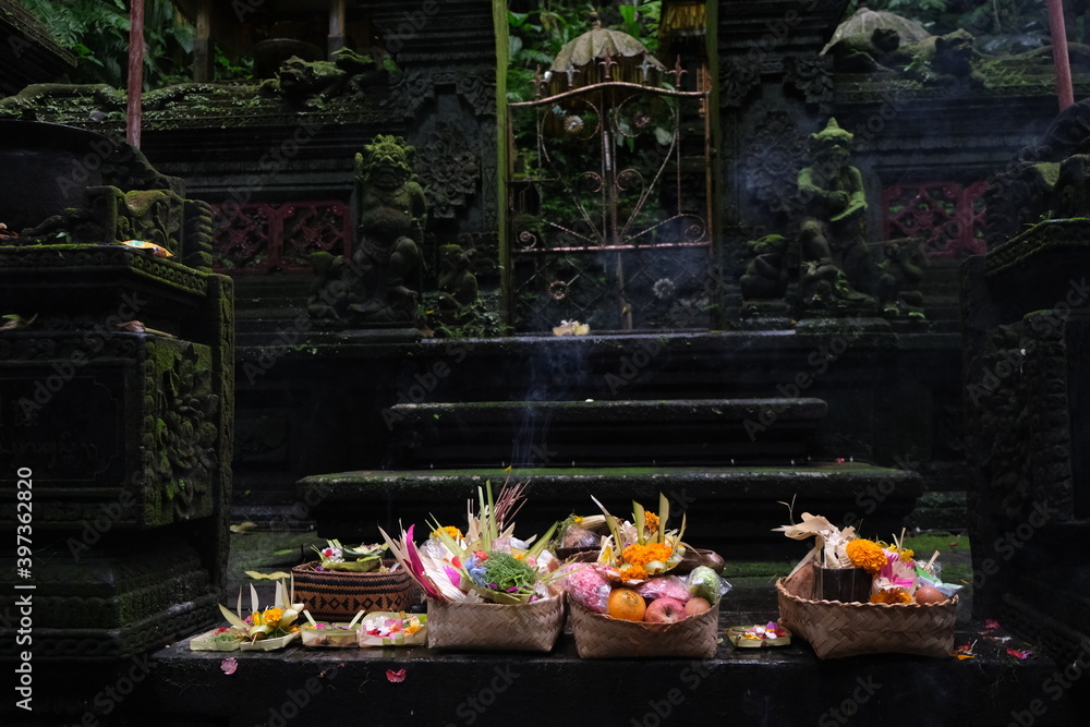 Fototapeta premium Baskets of offerings for the Balinese gods in a sacred place for prayers, requests and thanks