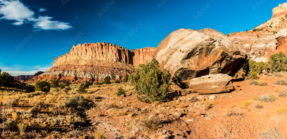 Large Boulder Below the Steep Cliffs of the Waterpocket Fold, Capitol Reef National Park, Utah, USA