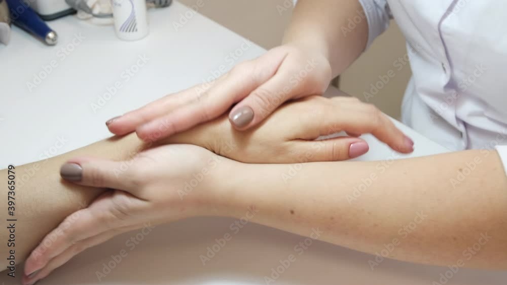 Hand massage after the procedure of manicure, beautiful female hands Hand massage after the procedure of manicure, beautiful female hands