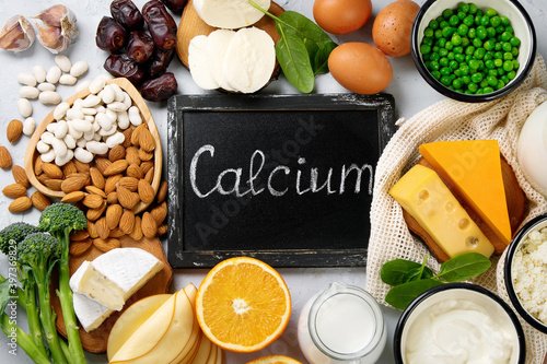 Healthy diary and non-diary products rich in calcium on grey background