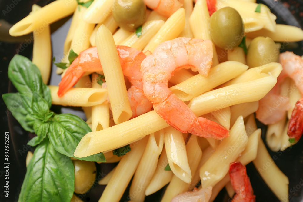 Plate of tasty pasta with shrimps and olives, closeup Plate of tasty pasta with shrimps and olives, closeup