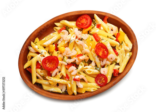 Plate of tasty pasta with shrimps and vegetables on white background