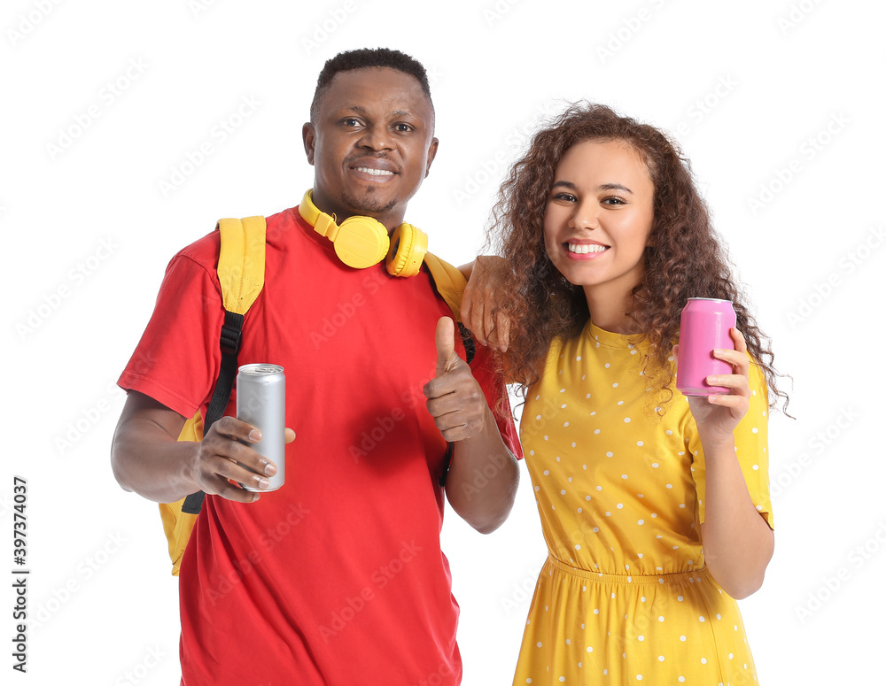 African-American couple with soda on white background